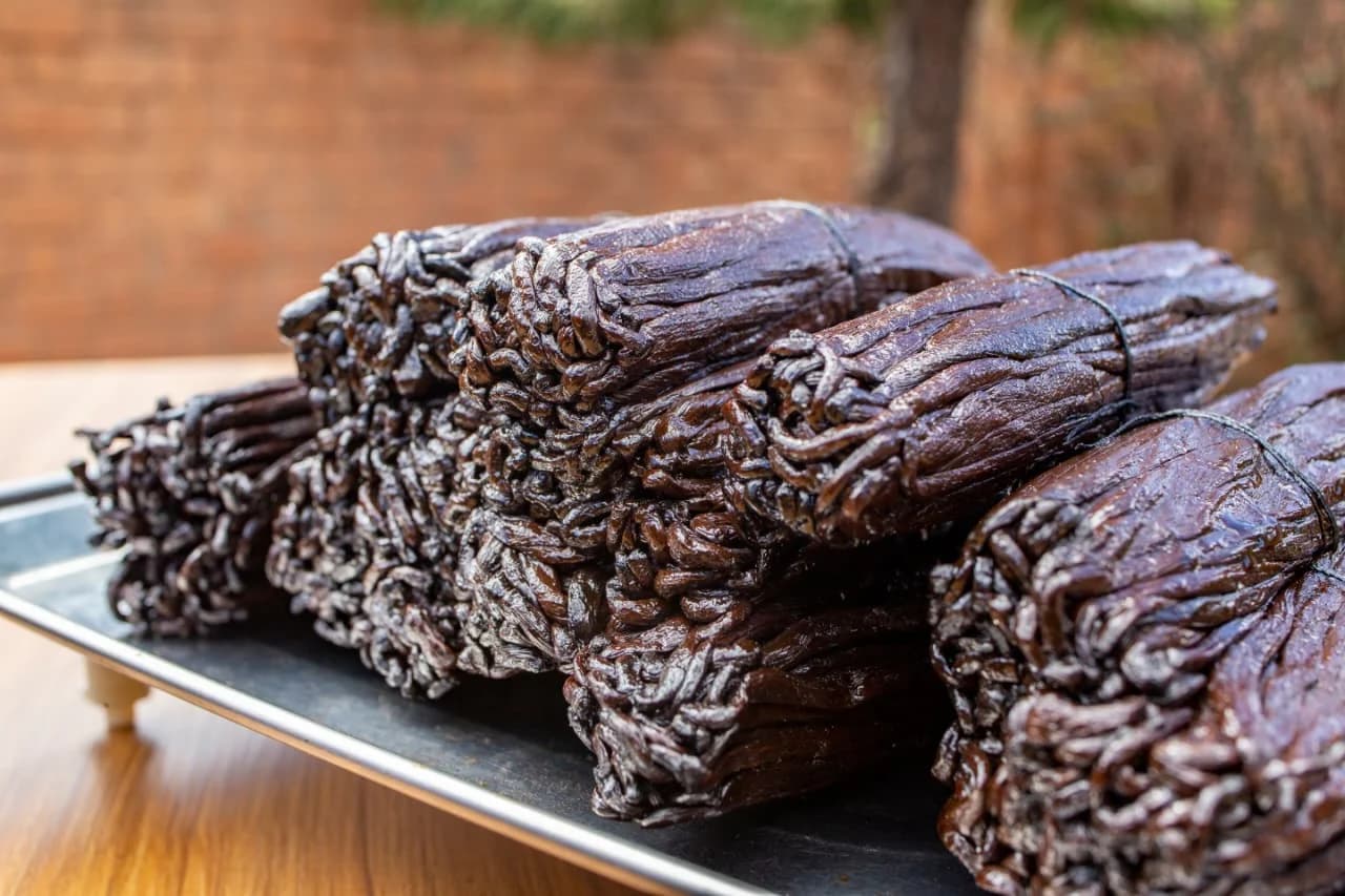Close-up of tied bundles of cured Grade A Madagascar vanilla beans